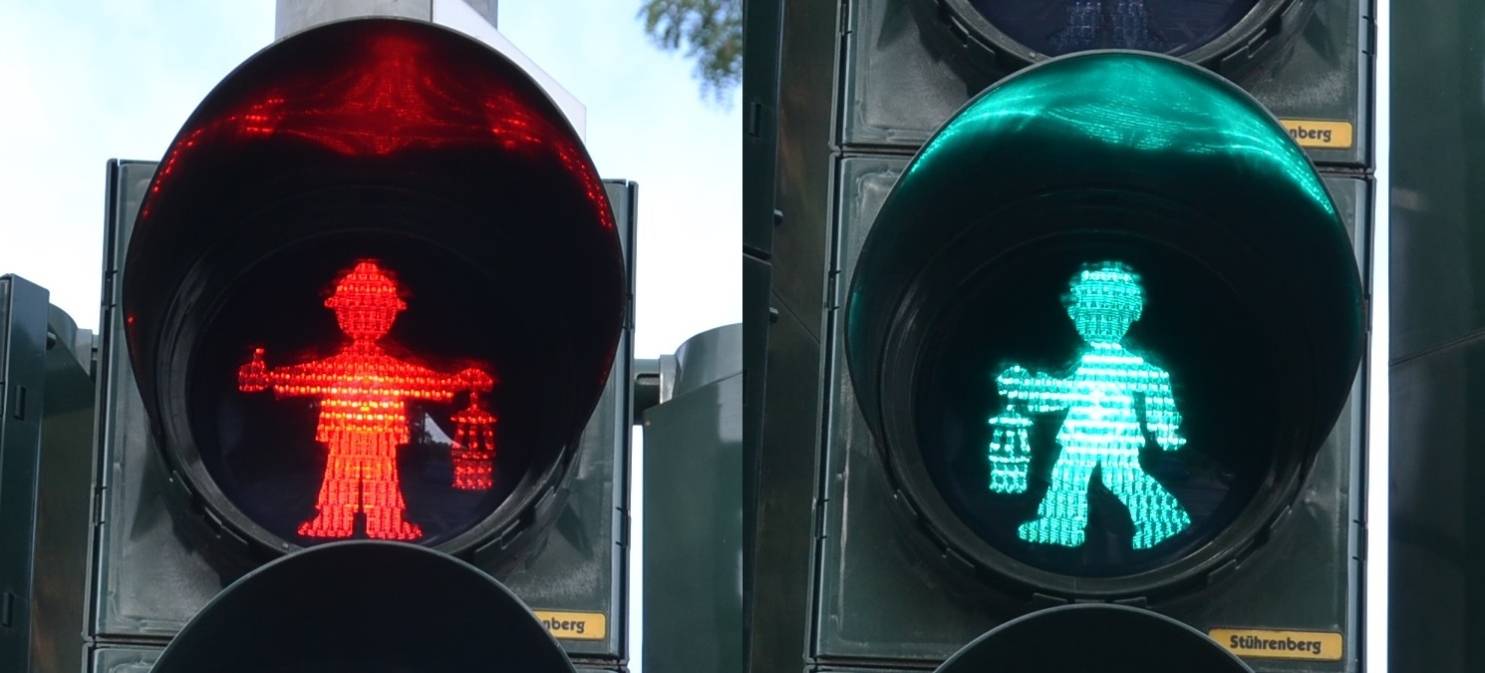 Das rote Männchen steht, das grüne geht, alles wie gehabt und nach Vorschrift, doch das neue Duisburger Ampelmännchen ist an Helm und Grubenlampe als Bergmann zu erkennen.
