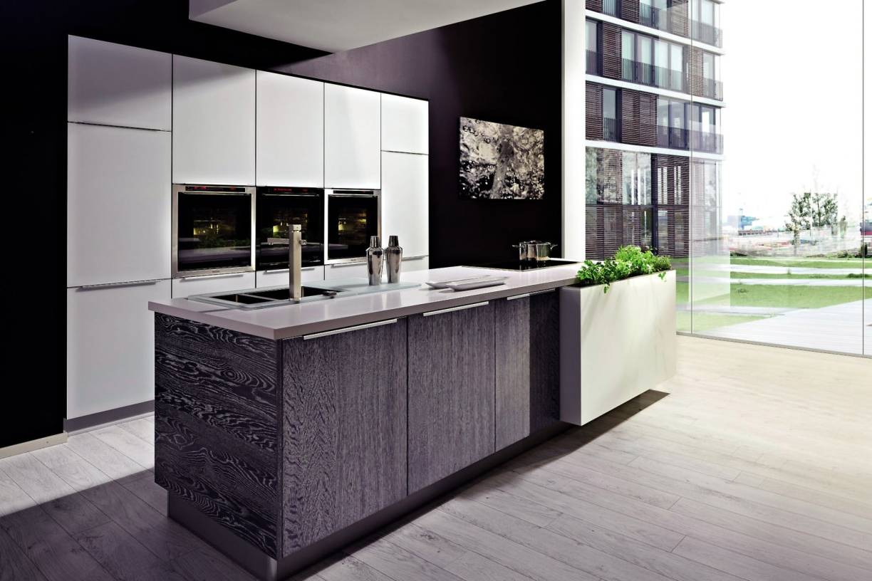 Bei der Küchenplanung kommt es auf ergonomische Details an, wie etwa möglichst kurze Wege zwischen Herd, Kühlschrank und Spüle.