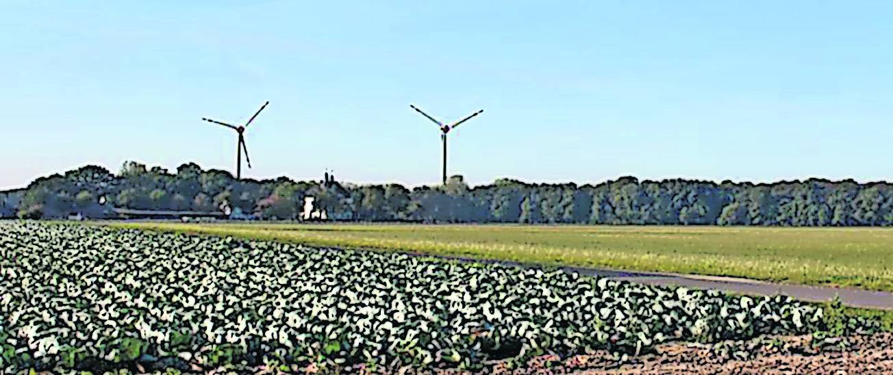  Die Foto-Simulation zeigt den Blick auf die geplanten Anlagen in südwestlicher Richtung auf Haus Neersdonk (weißes Gebäude links). Grafik: Gutachter 